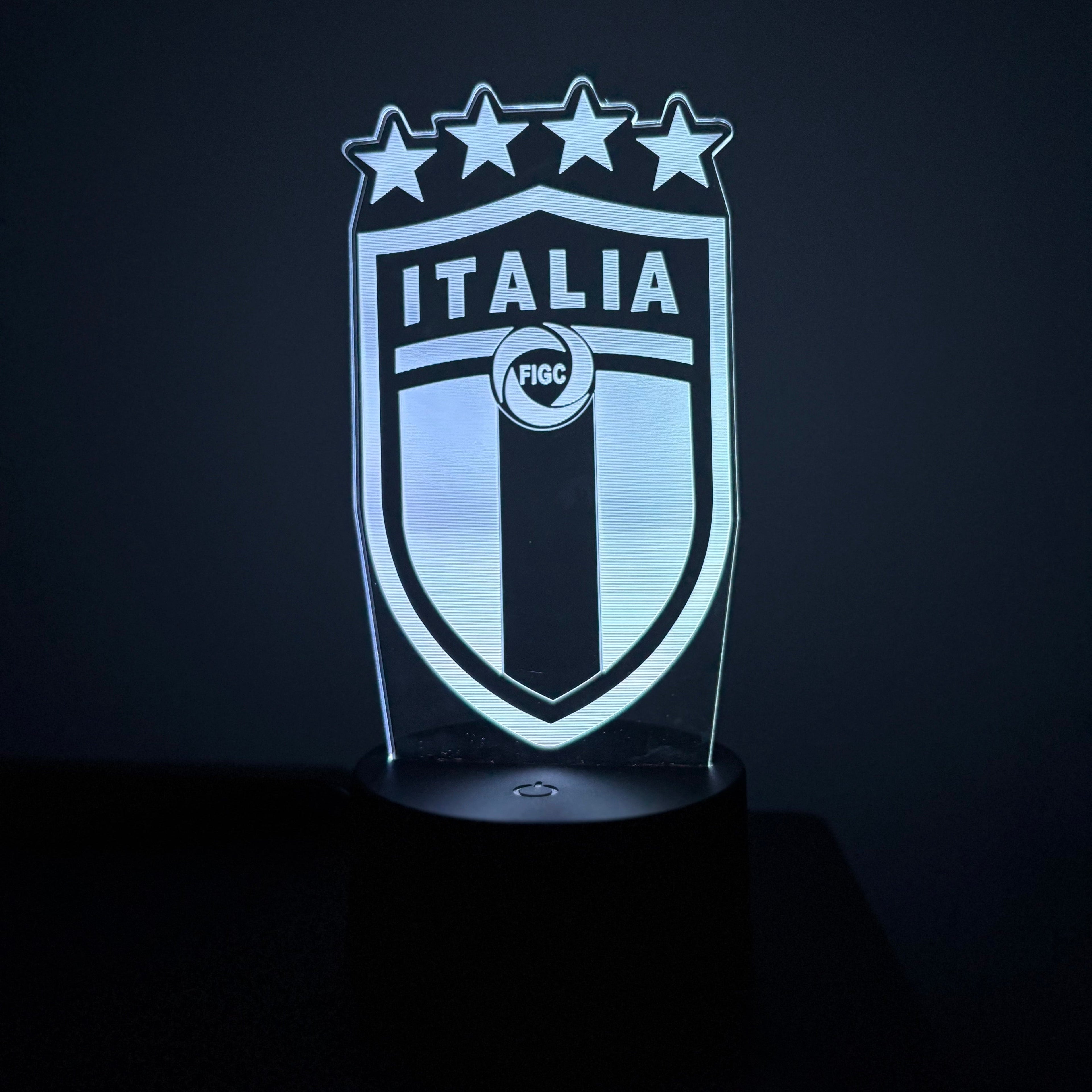 Light-up shield with 'Italia' text and star design on a dark background