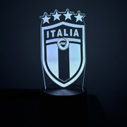 Light-up shield with 'Italia' text and star design on a dark background
