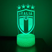 Green LED lamp with 'Italia' and star design on a dark background